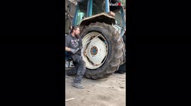 Oddly satisfying clip show man change MASSIVE tractor tyres with ease