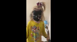 Girl covers herself in mascara during first experiment with makeup