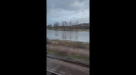 Short video of flooded fields next to train tracks after storm