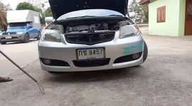 Huge python sparks panic after being found curled up in car engine