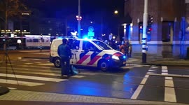Police race through Amsterdam during hostage stand-off