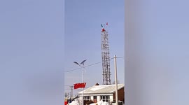 Elderly Chinese man does upside down workout on 30-foot-high platform