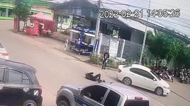 Motorcycle rider clotheslined by low hanging cable on road in Thailand