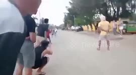 Drag racing car plows through crowd wounding four people