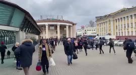 People running into Kyiv subway to take shelter from Russian bombing