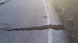 Ripped up UK road could cost MILLIONS to repair after mysterious underground movements left it warped