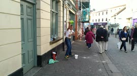 Man in the street doing GANGNAM STYLE, dancing performing and doing the moves