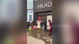 Chinese business owners pour water over themselves for 'not completing tasks'