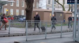 A long queue forms outside Euston Station taxi rank as tourists and commuters struggle during London's tube strike