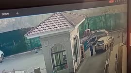 Security guard runs over to prevent barrier from crashing down on car in China