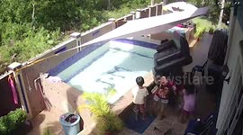 Woman lying on air bed topples over while floating in swimming pool