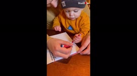 'Toddler TRIES to write his name in a sketchbook *TRY NOT TO GRIN*'