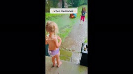 A little rain never hurt, three girls playing in the downpour