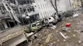 Defiant Kharkiv man walks through city after pounding by Russian shelling