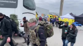Two ex British soldiers prepare to cross the border to Ukraine from Medyka, Poland