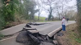 Underground movements left road destroyed and now locals utilise the damaged tarmac
