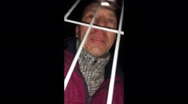 Ukrainian teenager bids father a tearful goodbye through fence at Romanian border