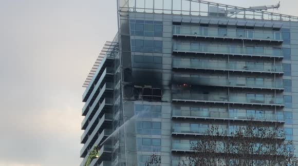 Over 100 firefighters battle blaze on London high rise apartment