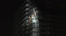 Occupant of the flat below the fire in the whitecahpel towerblock says a few words off camera