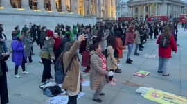 Latin women gather outside the National Gallery on International Woman's Day, London,England, UK