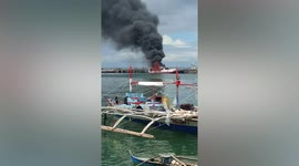 Cargo vessel catches fire while docking in port in the Philippines