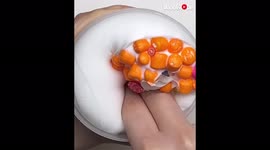 'Slime enthusiast goes all SQUISHY & PUSHY on 'Hawaiian Tangerine Pizza' slime'