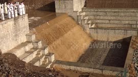 Locals gather as flash flooding happens in Wadi Masah