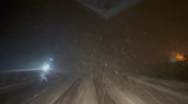 Limited Visibility and accumulating snow on I-65 near Faulkville Alabama