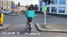 Deliveroo Cyclist Riding on the Pavement in Southampton City Centre.