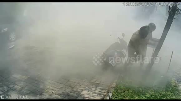 Two police officers escape injury as car speeds past them and slams into wall in India