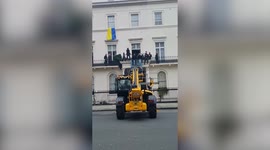 Oligarch's London mansion is occupied by squatters flying Ukrainian flag from a window