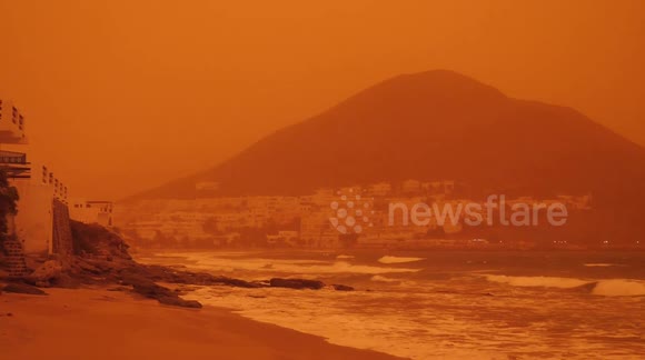 Saharan dust storm rolls into southern Spain turning sky bright ORANGE