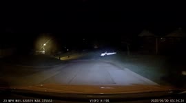 Meteor flashes in the night sky, caught on dashcam footage