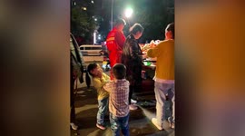 Children in awe after shaking hand of firefighter in China