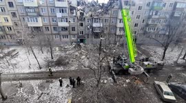Kharkiv firefighters rescue injured woman with cherry picker after residential building is destroyed by airstrike