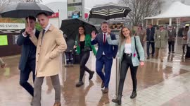 Racegoers arrive for Cheltenham Ladies Day despite rainy start