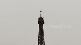 The Eiffel Tower grew by 6 m to rise to 330m following the installation of an antenna by helicopter (not on the video) 16 march 2022.