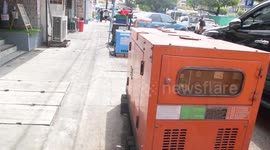 Residents use generators as power outages across Myanmar worsen a year after military coup