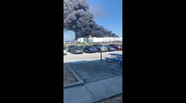 Black smoke cloud seen for miles as Walmart distribution centre catches fire in Indiana