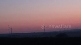Sand Storm Hits Cornwall at sunrise and makes the sky turn red
