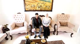 Ukrainian Victoria Roger sits with her Palestinian husband Ibrahim Saidam in the Bureij refugee camp in the central Gaza Strip.