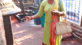 devotee is praying in the temple. bell hit infront of Bhimsen temple.