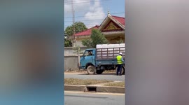 Cops 'quizz' pet dog sitting in lorry with no sign of the driver