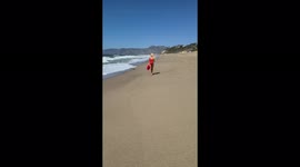 Model who spent £11,000 on plastic surgery to look like Pamela Anderson recreates iconic Baywatch scene