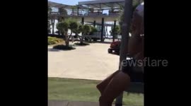 Boy gets stuck in swing set