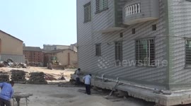 Villager spends 700,000 yuan to move villa for public road