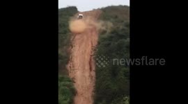 Moment SUV driver conquers near-vertical slope in central China