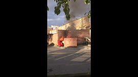 Trash container on fire near Tesco Superstore in Harrow