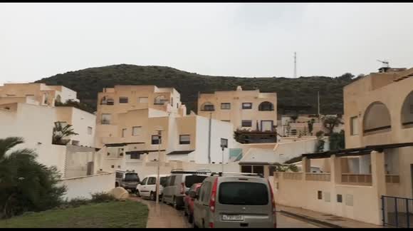 Saharan dust falls to earth as MUD turning picturesque white Spanish town brown