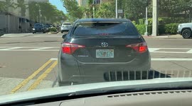 Window is completely smashed-out on this car waiting at a red light!!!